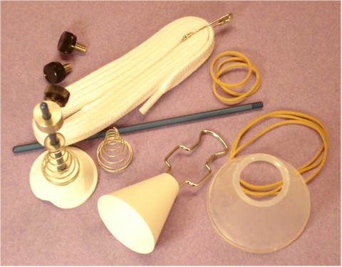 Set includes the Tugger, Retaining cone, Pusher, short and long center Rods, Collar, 2 spare set screws and fail-safe lace, plus stainless conical inner spring with washer and 6 sample rubber bands